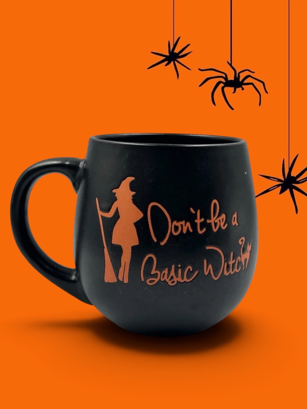 "Don't Be a Basic Witch" matte black ceramic coffee mug designed by Prima Design